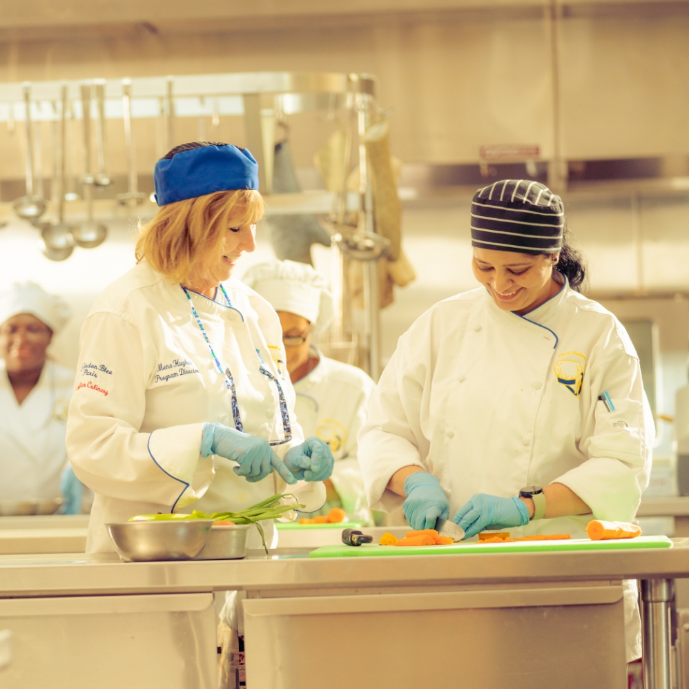 two adult female chefs